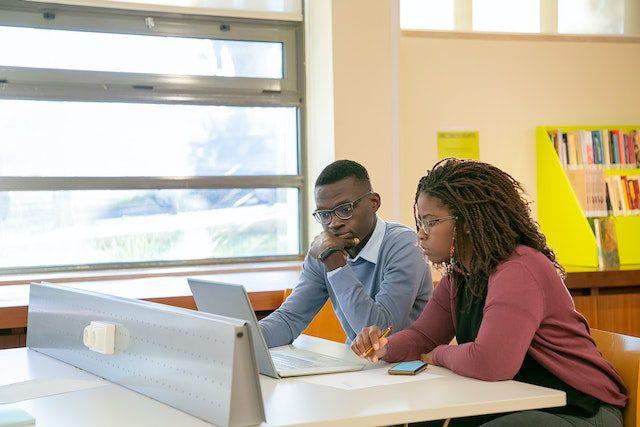 black-couple-doing-presentation-for-studies-in-classroom