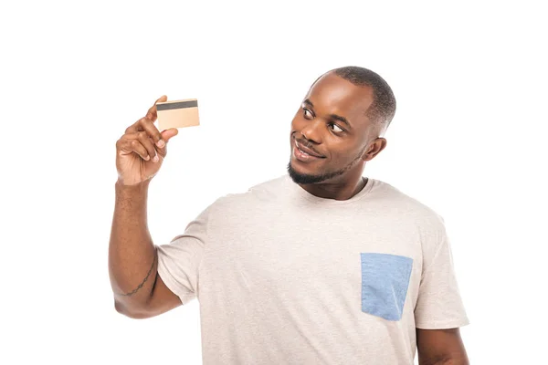 A young man holding a credit card