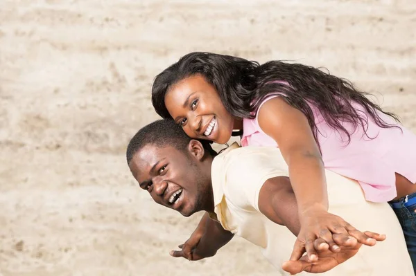 Smiling beautiful woman and her handsome boyfriend having tender moments